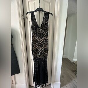 Full length black lace overlay gown.